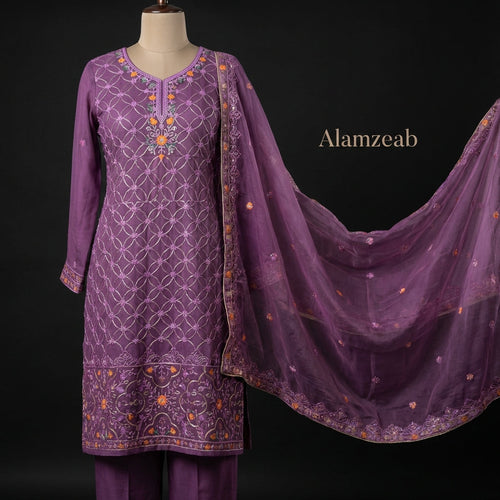 Create a luxurious, high-resolution image showcasing the 'Alamzeab' traditional ensemble in a sophisticated studio setting. Use softbox lighting to evenly illuminate the vibrant purple Mysuri shirt, emphasizing the intricate silver vine embroidery and brig